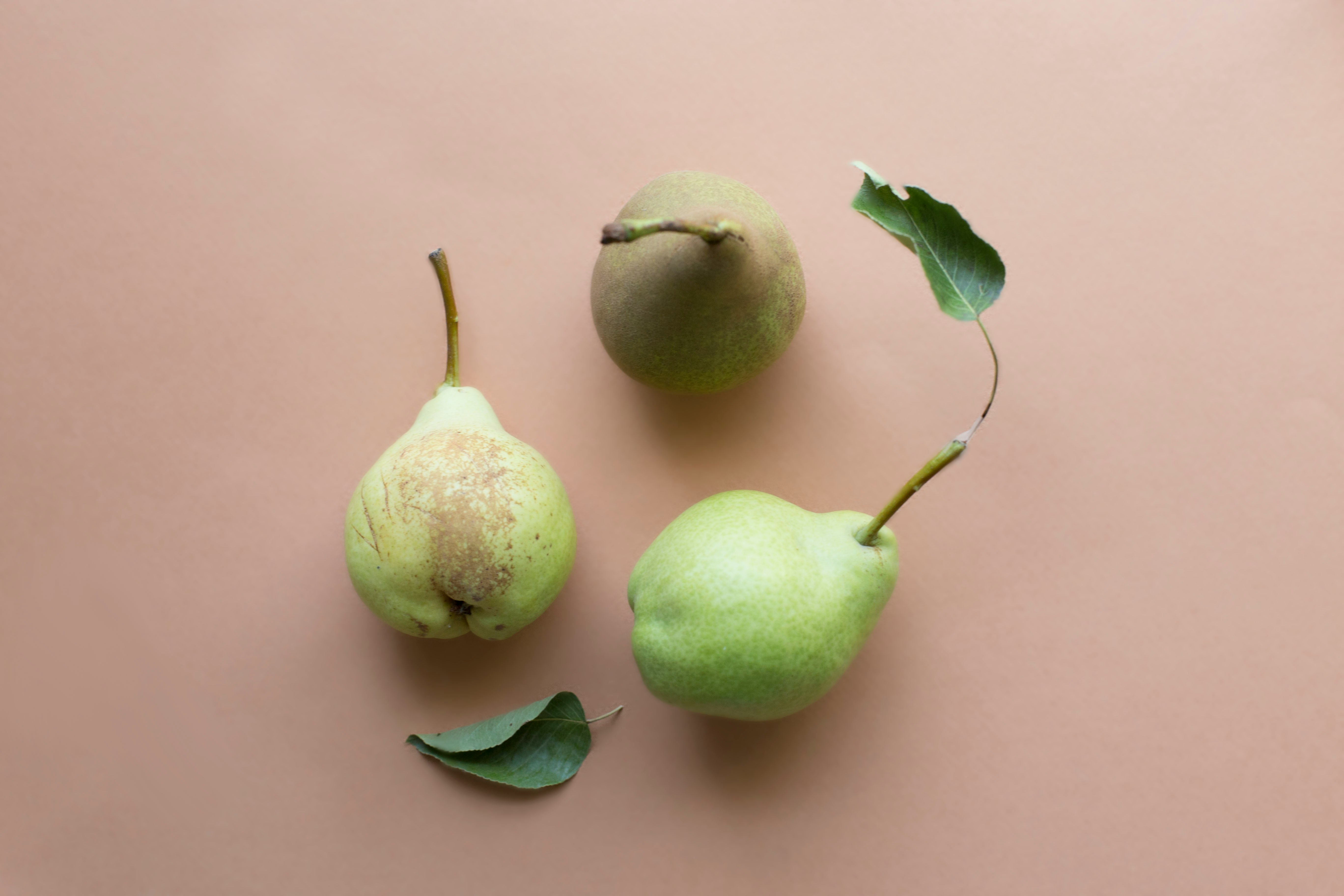 three yellow peach fruits